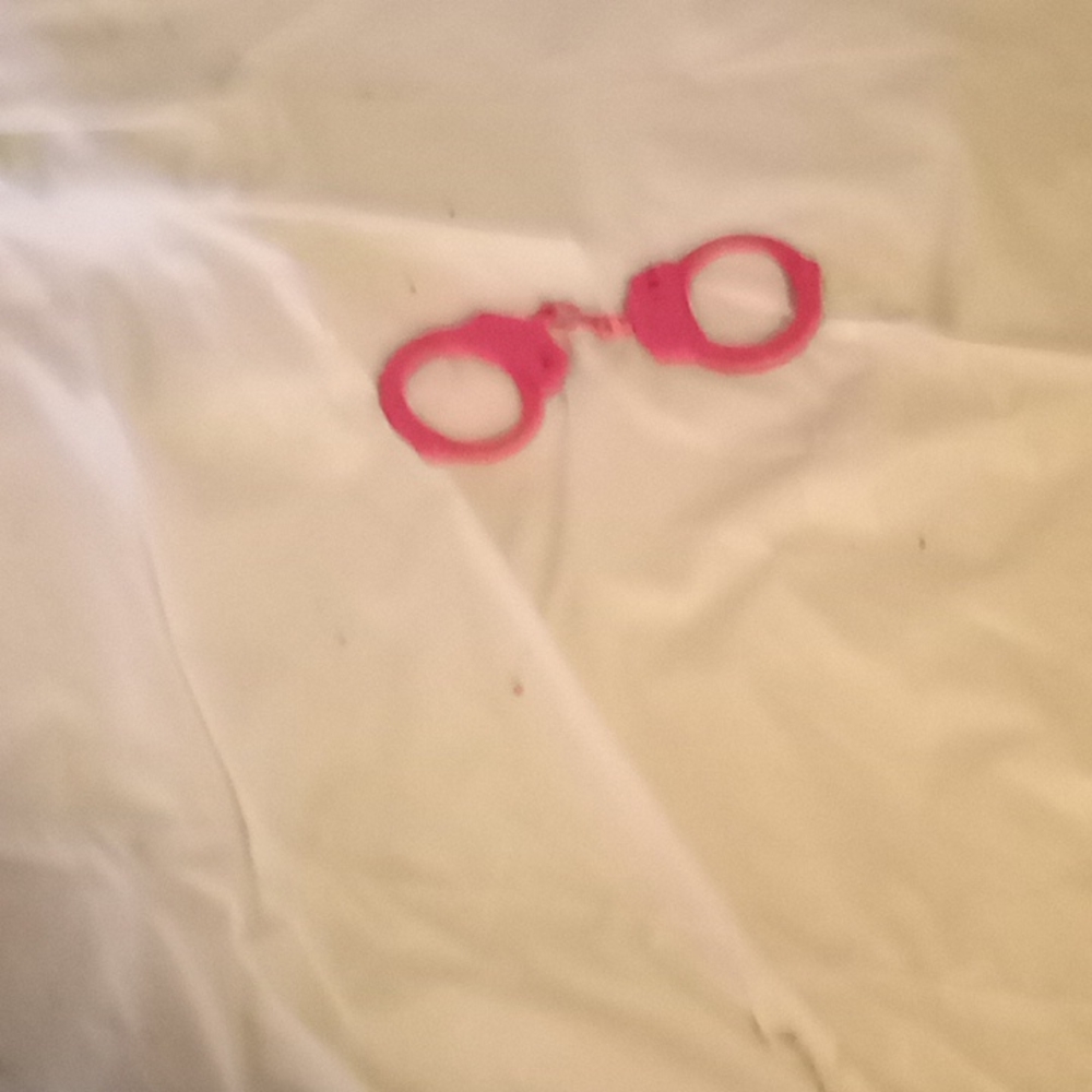 Pink pair of woman police handcuffs